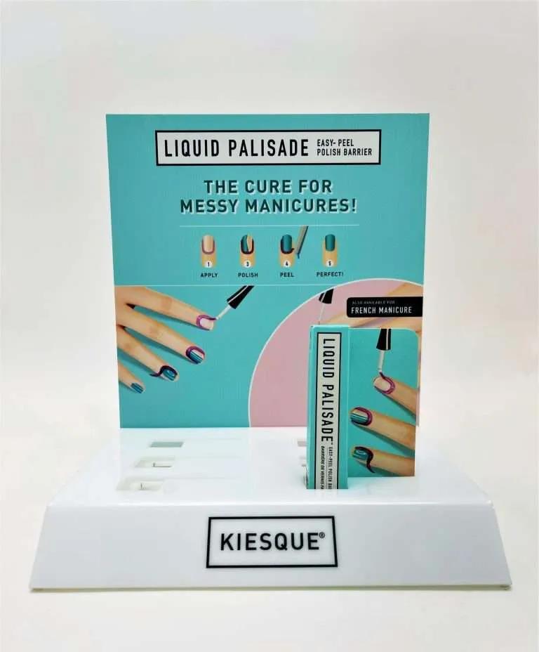 White-based acrylic countertop cosmetic display with a full-color printed header graphic