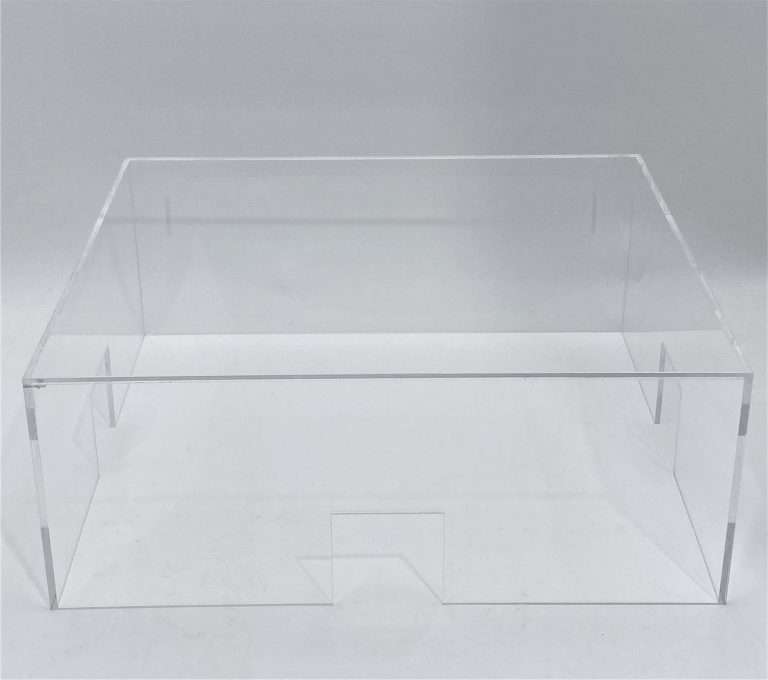 Clear acrylic cover with laser-cut access holes fitted over a piece of research equipment