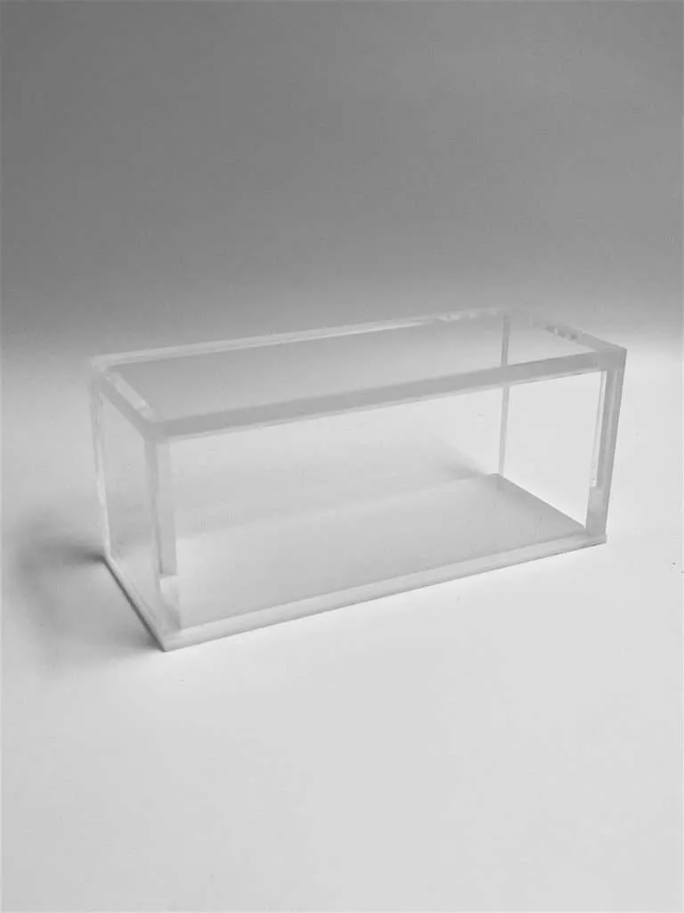 Clear acrylic box with bonded sealed corners and a removable frosted white base lid.