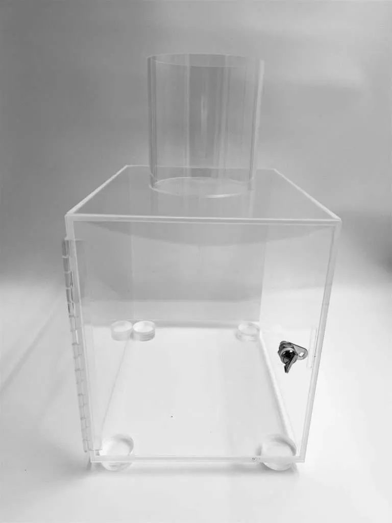 Clear acrylic sealed research compartment with a top cylinder port, ball feet, and a keyed lock.