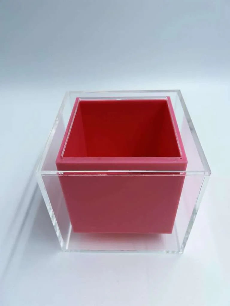 Custom acrylic ice box with a clear outer shell and an opaque pink inner container