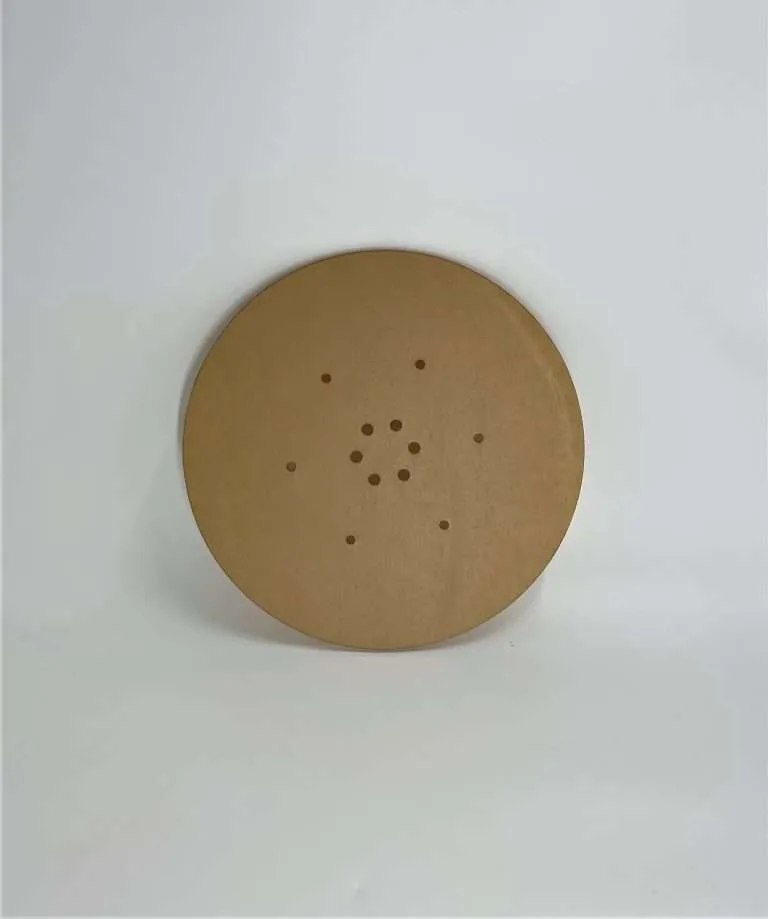 Round laser-cut acrylic replacement part with a precise pattern of drilled holes