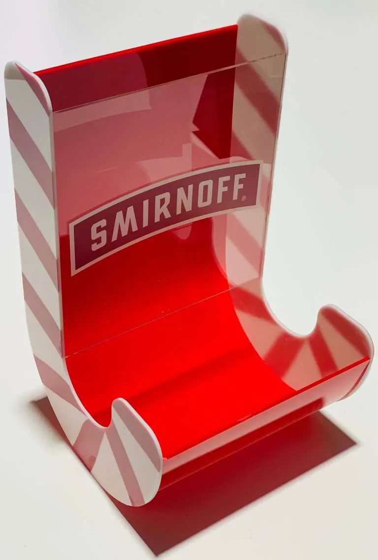 Curved red and white acrylic bottle display stand with printed branding.