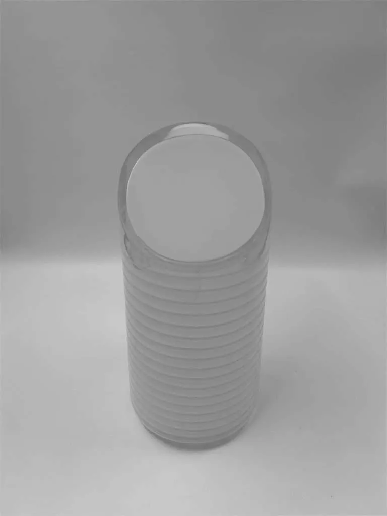 Cylindrical light fixture fabricated from translucent white acrylic with a soft glow.