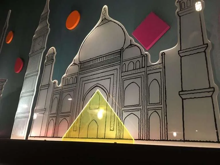 UV-printed acrylic exhibit panel shaped like a landmark with colored acrylic accents.